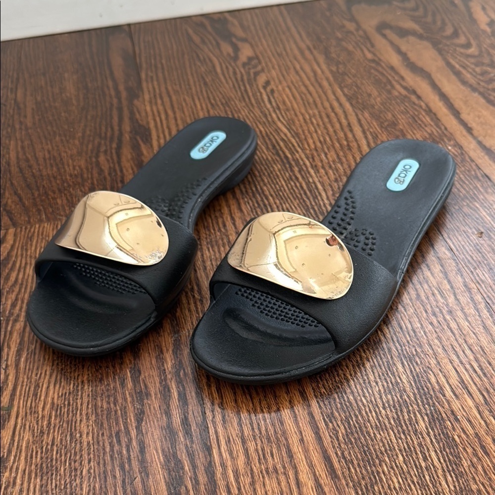 OKA b. Women’s Medium/7-8 Black and Gold Sandals with Bold Metallic Design